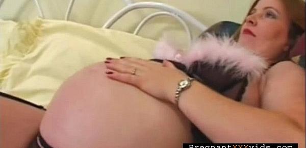  Mature pregnant plays with herself